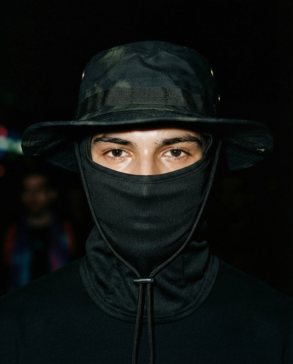 NOTTURNO — black boonie hat with balaclava on model, night flash portrait