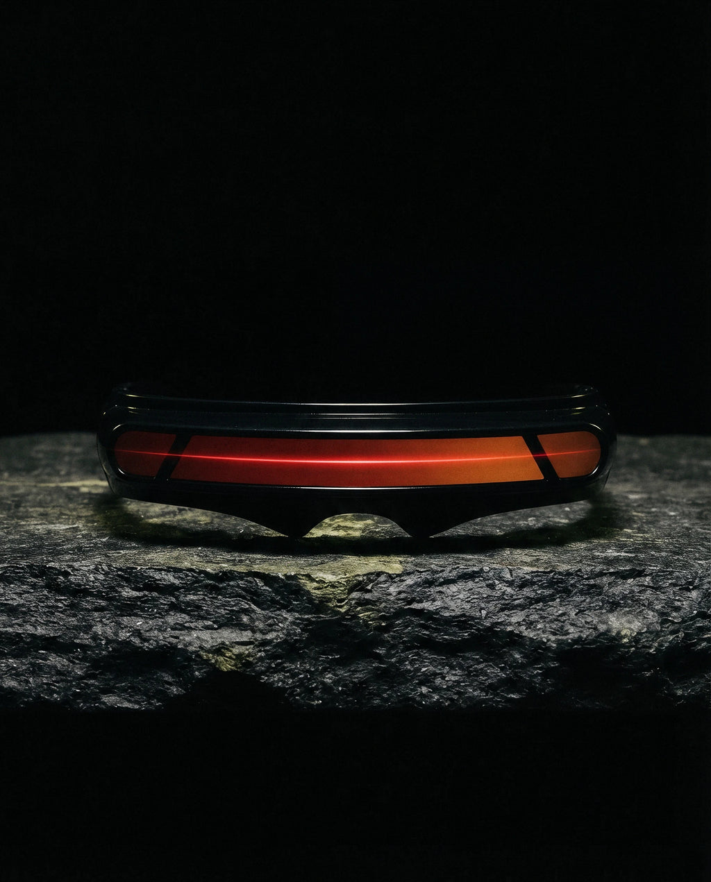 PONENTE — single-band visor sunglasses still life on basalt stone