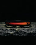 PONENTE — single-band visor sunglasses still life on basalt stone