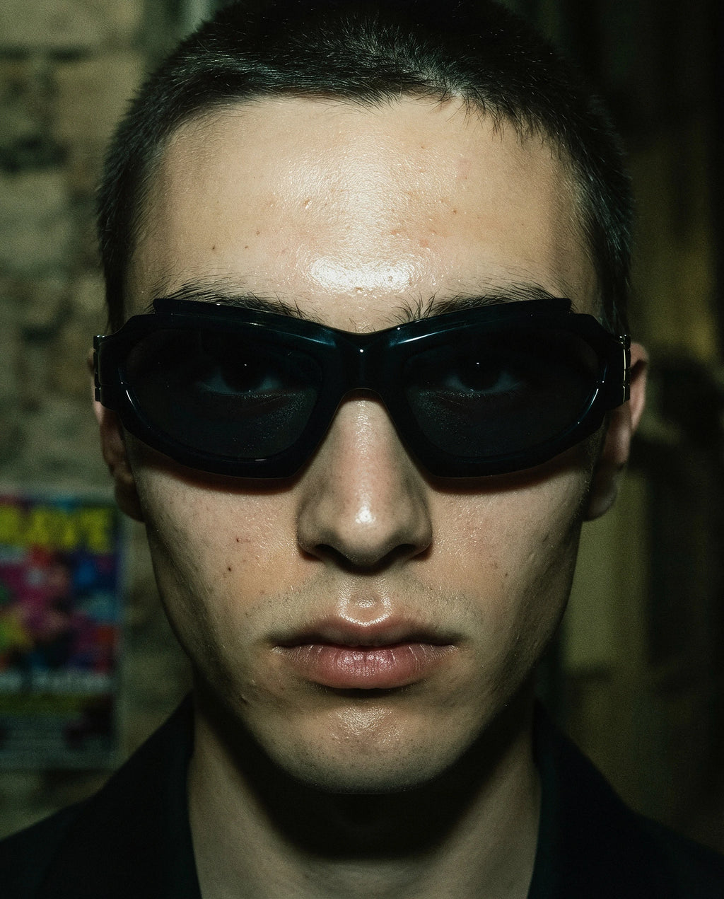 SCIROCCO — black Y2K wraparound sunglasses on model, night flash portrait — angle view