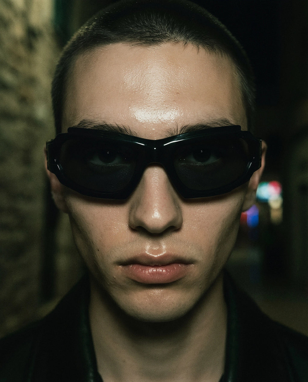 SCIROCCO — black Y2K wraparound sunglasses on model, night flash portrait